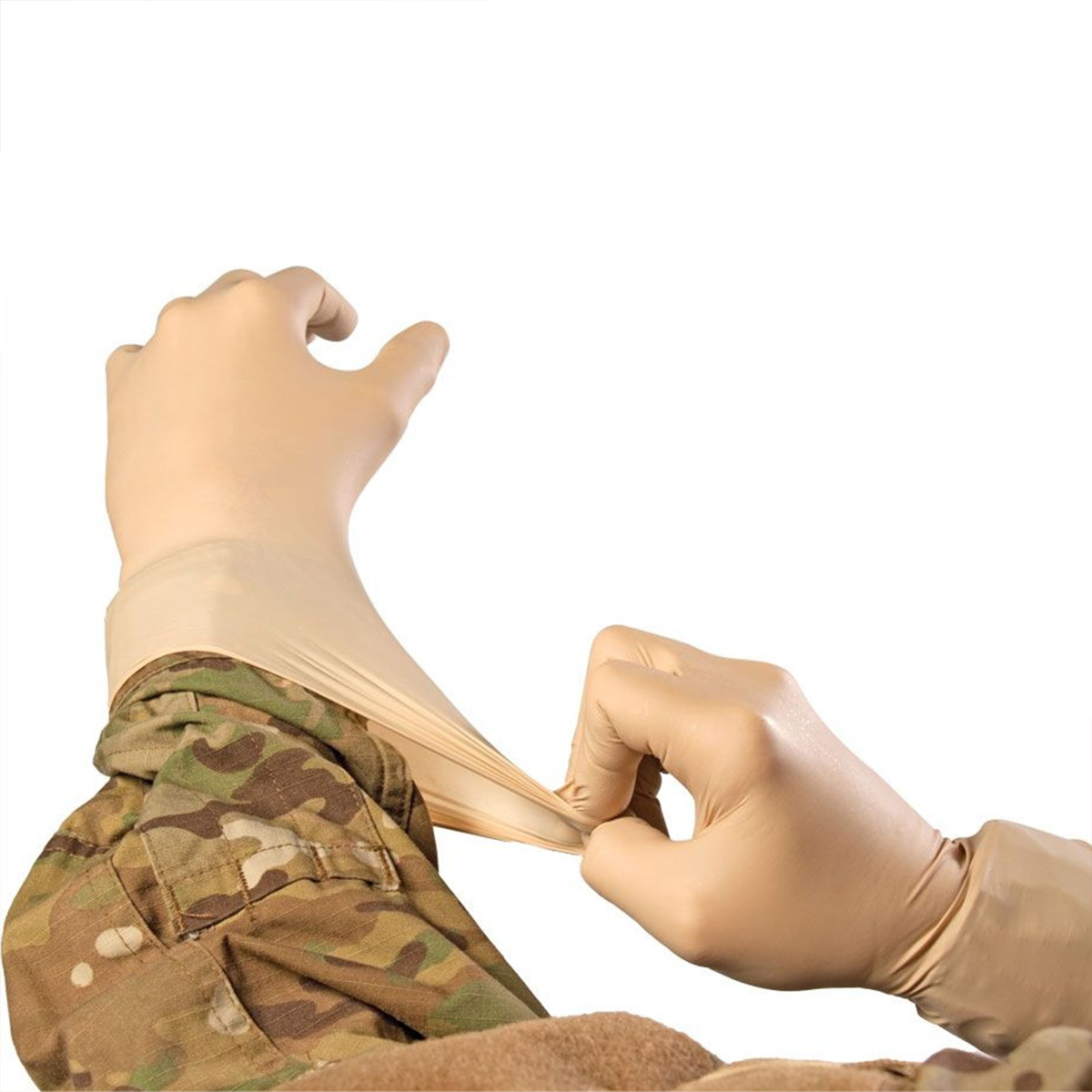 A close-up of hands putting on beige nitrile gloves